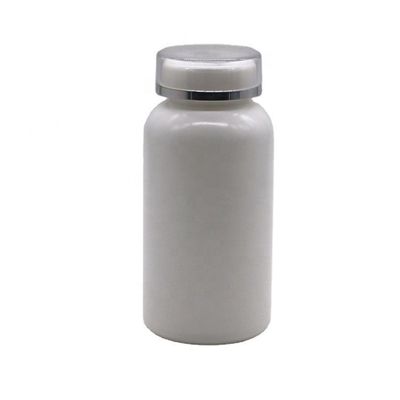 Bottiglia per compresse in plastica in HDPE a forma rotonda da 200 ml con coperchio flessibile e materiale PE